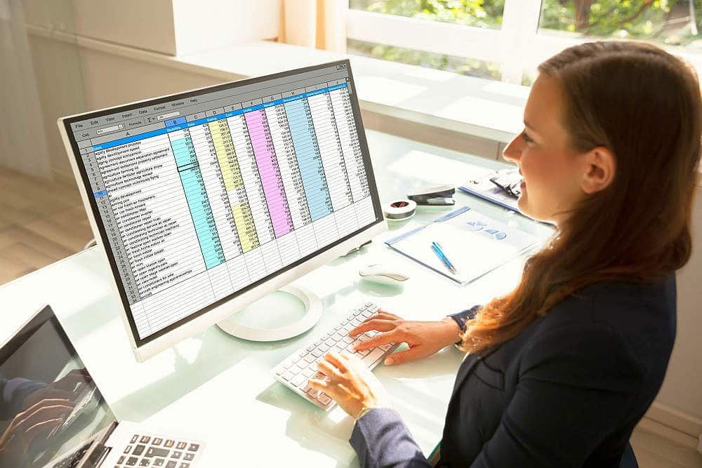Professional Young Businesswoman Working On Computer In Office | Why Is Regular Account Reconciliation Important In Business? | account reconciliation process
